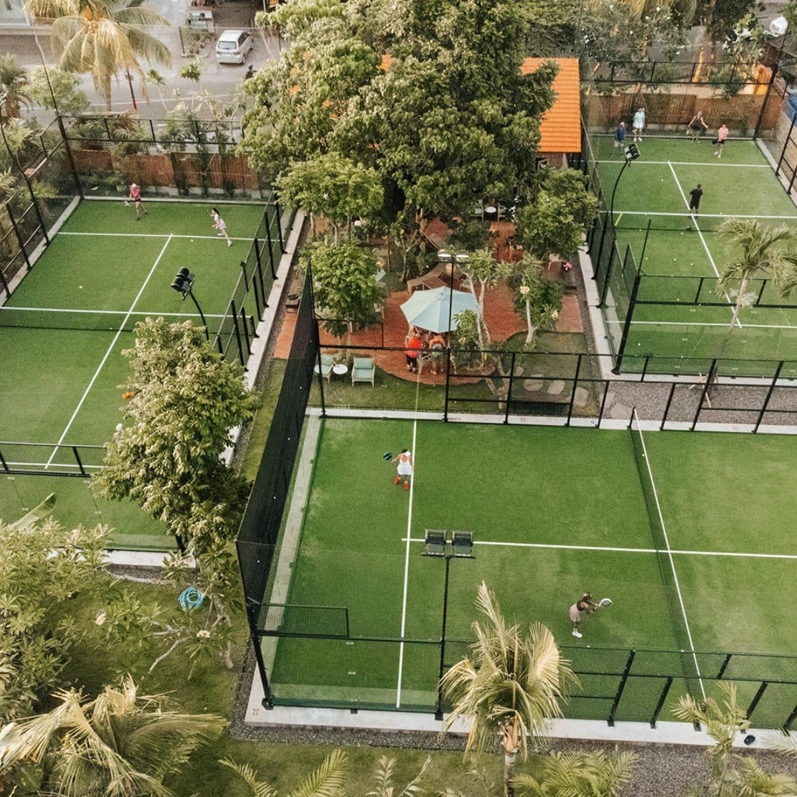 Padel and tennis courts among the trees
